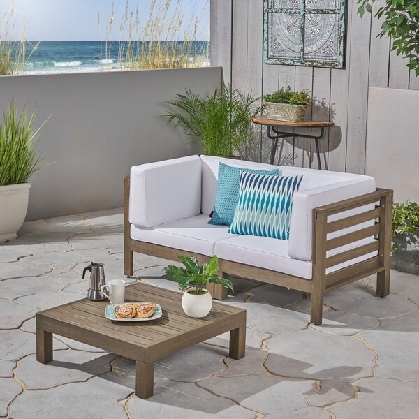 Oana Outdoor 2Seater Acacia Wood Sectional Loveseat and Coffee Table Set with Cushions by Christopher Knight Home