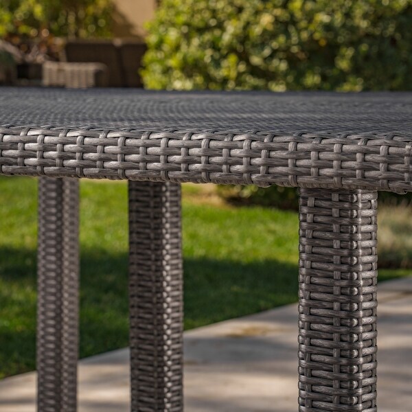 Outdoor 64 Inch Square Dining Table with Wicker Pulled Over an Iron Frame