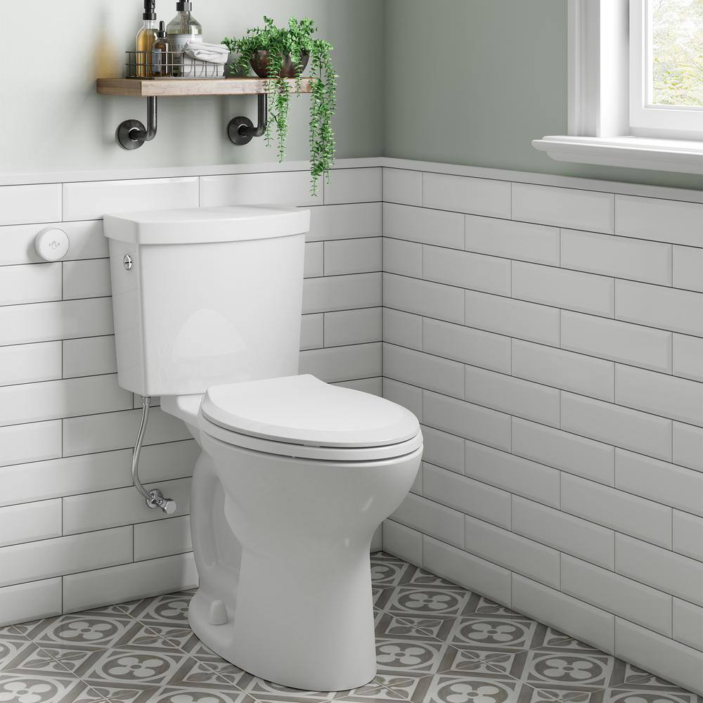 American Standard Cadet Touchless 2-piece 1.28 GPF Single Flush Elongated Toilet in White Seat Included 580AA709.020