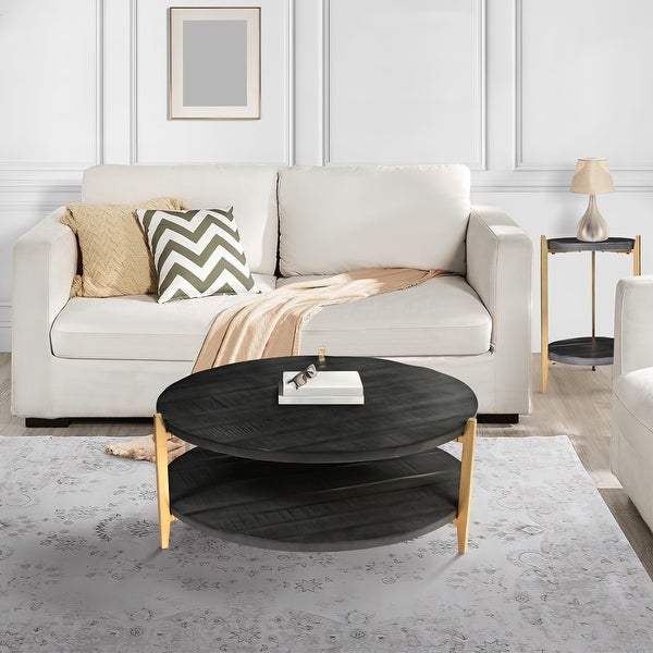 Tali 37 Inch Handcrafted Round Coffee Table， 2 Tier， Charcoal Gray Acacia Wood， Sleek Gold Metal Legs