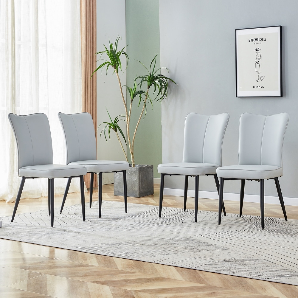 Modern dining chairs. 4 piece set of light gray PU seats with black metal legs. Suitable for restaurants  living rooms