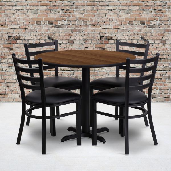 Carlton 36'' Round Walnut Laminate Table Set with X-Base and 4 Ladder Back Metal Chairs - Black Vinyl Seat