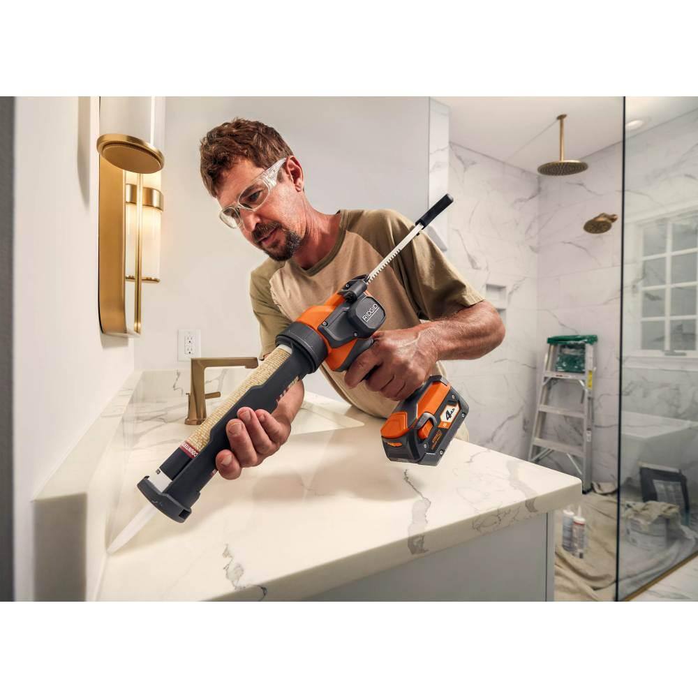 RIDGID 15 Amp Corded 12 in. Dual Bevel Miter Saw with LED Cutline Indicator and 18V Cordless 10 oz. Caulk and Adhesive Gun R4123-R84044B