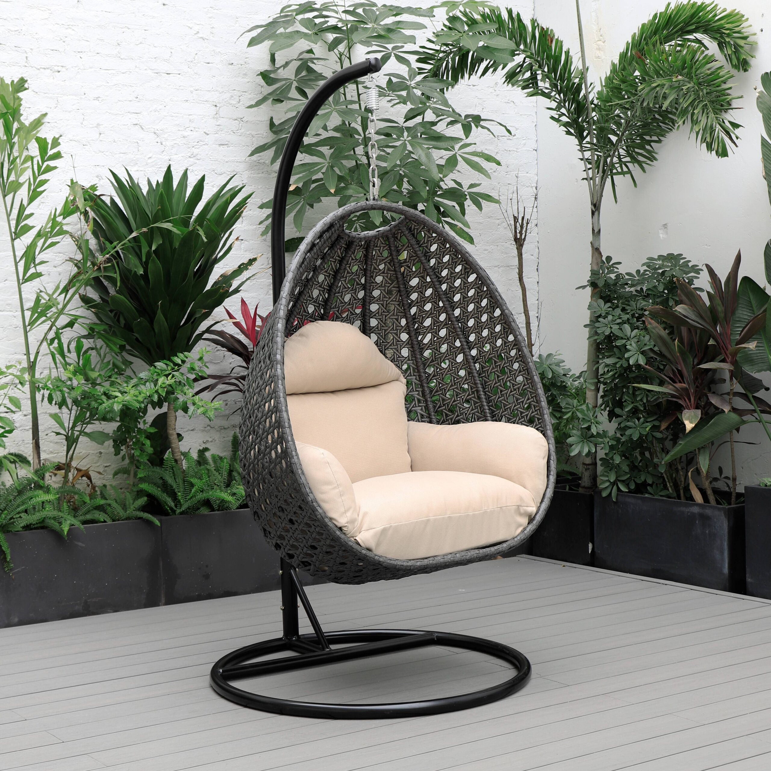 LeisureMod Charcoal Wicker Indoor Outdoor Bedroom Patio Hanging Egg Swing Chair with Stand and Cushion Beige