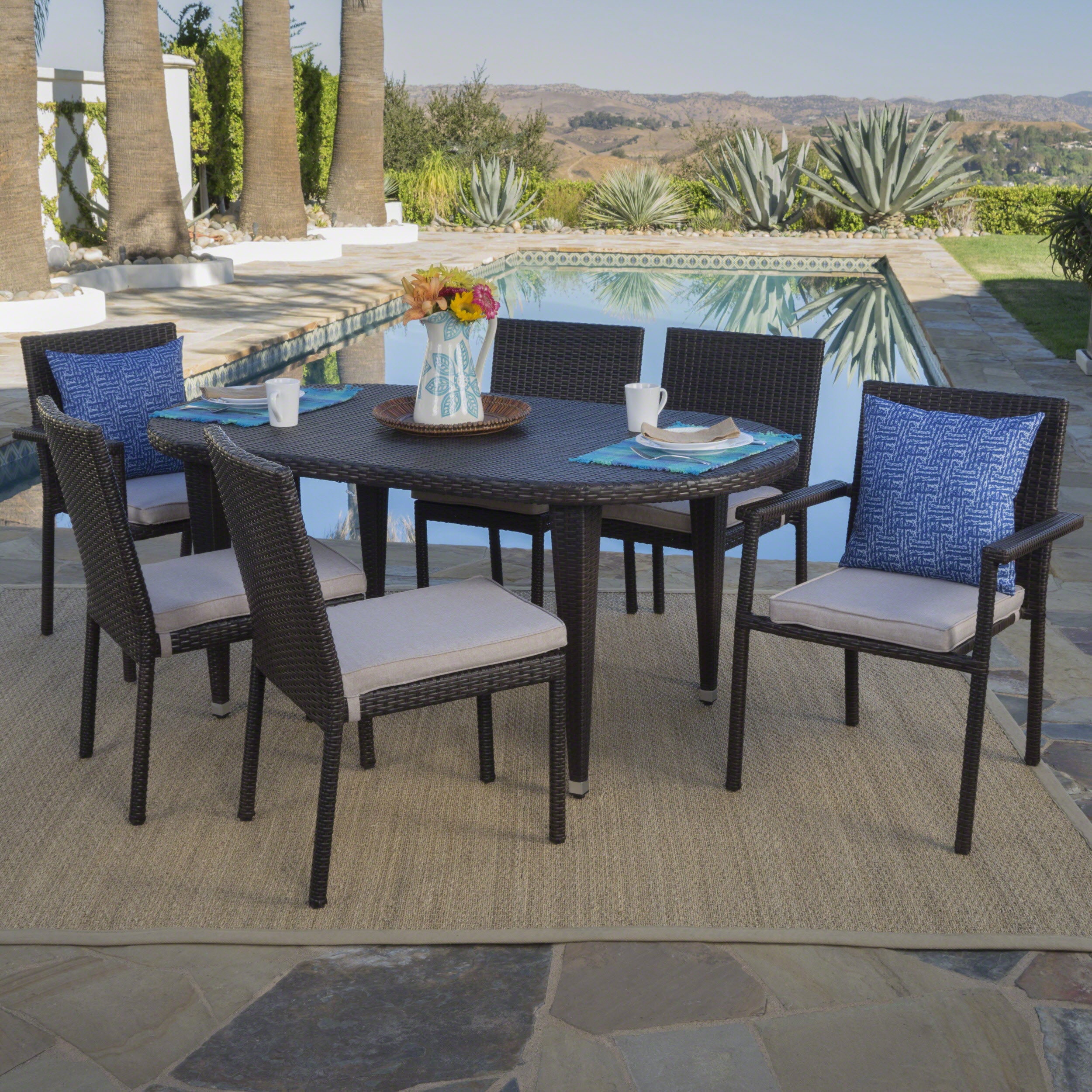 Logan Outdoor 7 Piece Wicker Dining Set with Armed and Armless Stacking Chairs