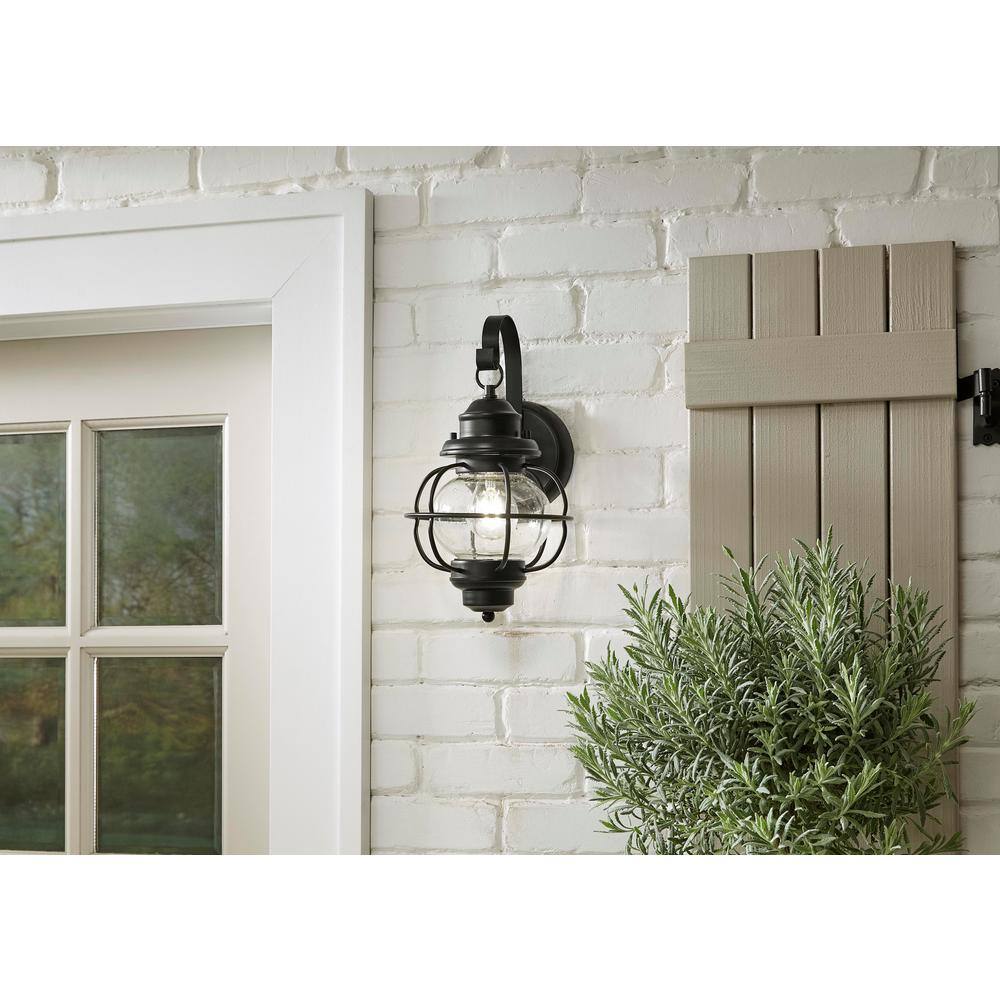 Home Decorators Collection Greer 1-Light Black Exterior Wall Lantern Sconce with Caged Seeded Glass HDP13669