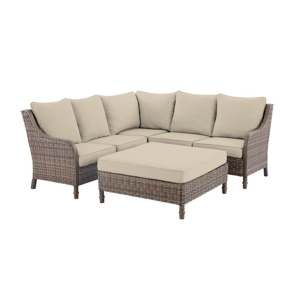 Hampton Bay Windsor 4-Piece Brown Wicker Outdoor Patio Sectional Sofa with Ottoman and CushionGuard Biscuit Tan Cushions H193-01203800