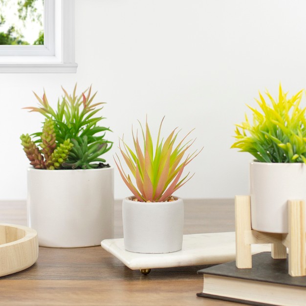 Green Artificial Sword Grass In A White Pot