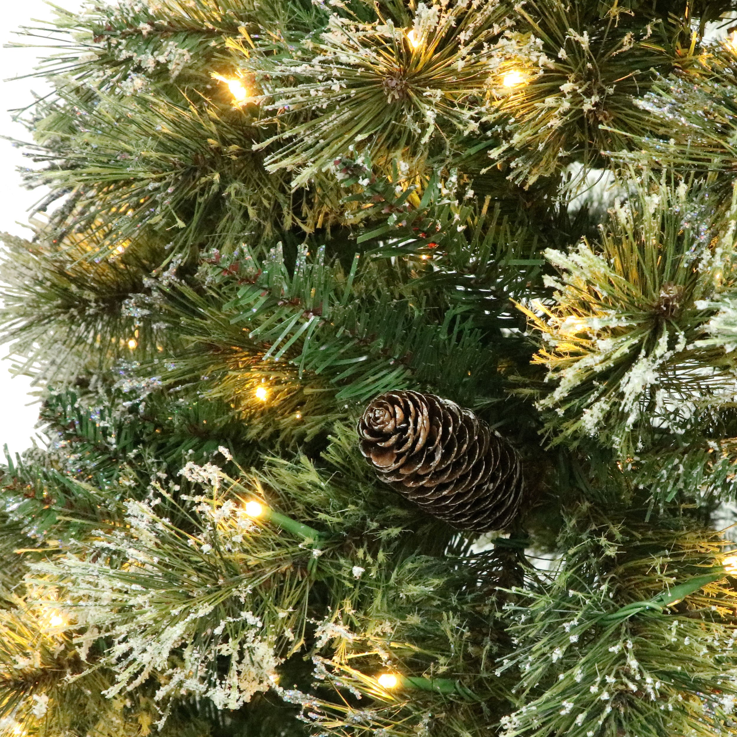 7-foot Cashmere Pine and Mixed Needles Pre-Lit Clear LED Hinged Artificial Christmas Tree with Snow and Glitter Branches and Frosted Pinecones