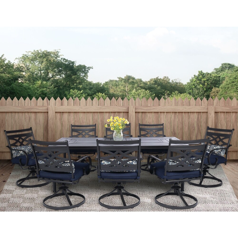 Hanover Montclair 9 Piece Dining Set in Navy Blue with 8 Swivel Rockers and a 42 In. x 84 In. Table