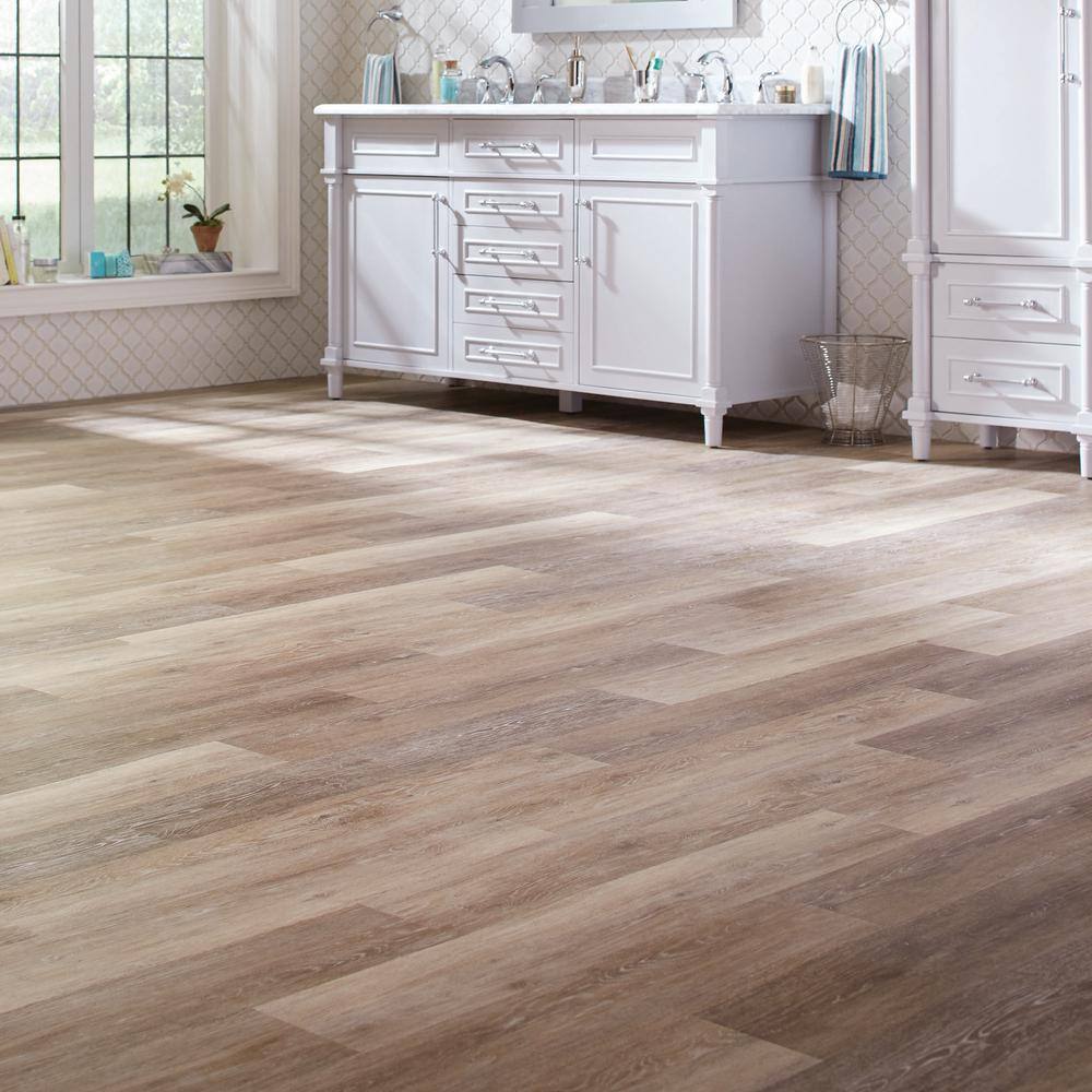 TrafficMaster Khaki Oak 4 MIL x 6 in. W x 36 in. L Grip Strip Water Resistant Luxury Vinyl Plank Flooring (24 sqftcase) 185312