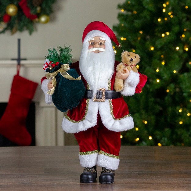 Standing Santa Christmas Figure With A Plush Bear