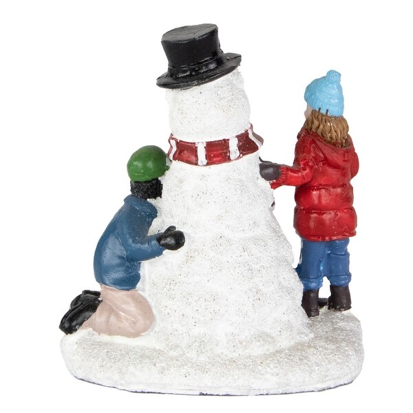 Children Build a Snowman Christmas Village Display Piece