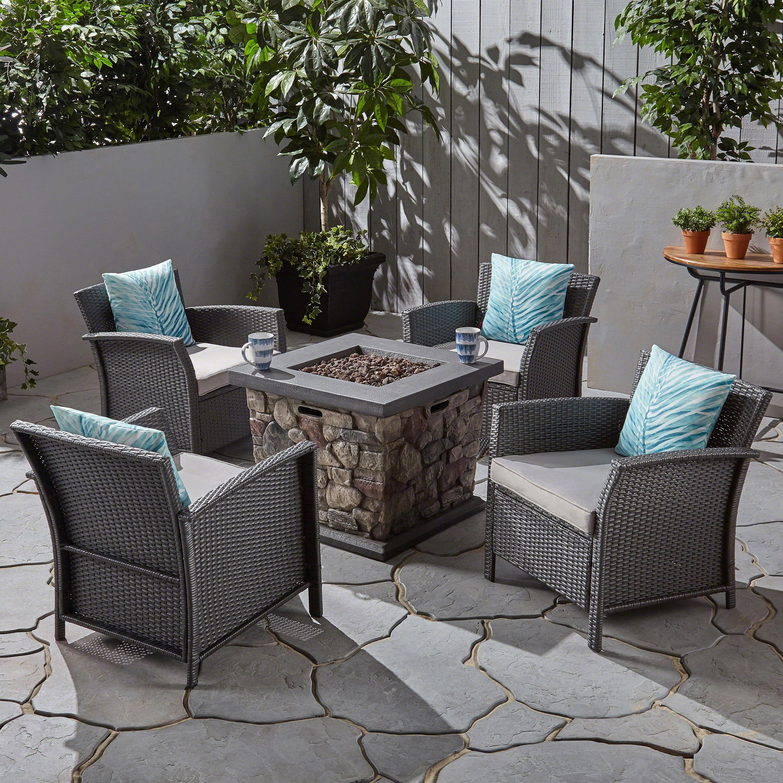 Laiah Outdoor 4 Piece Wicker Club Chair Chat Set with Stone Finished Fire Pit