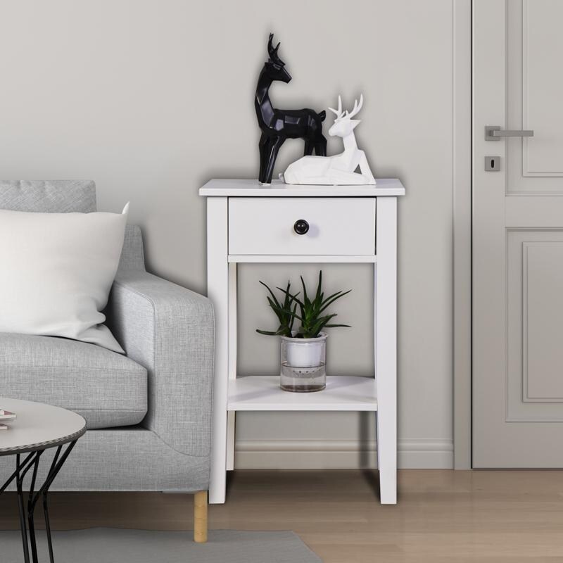 The white bathroom floor to ceiling storage table has a drawer