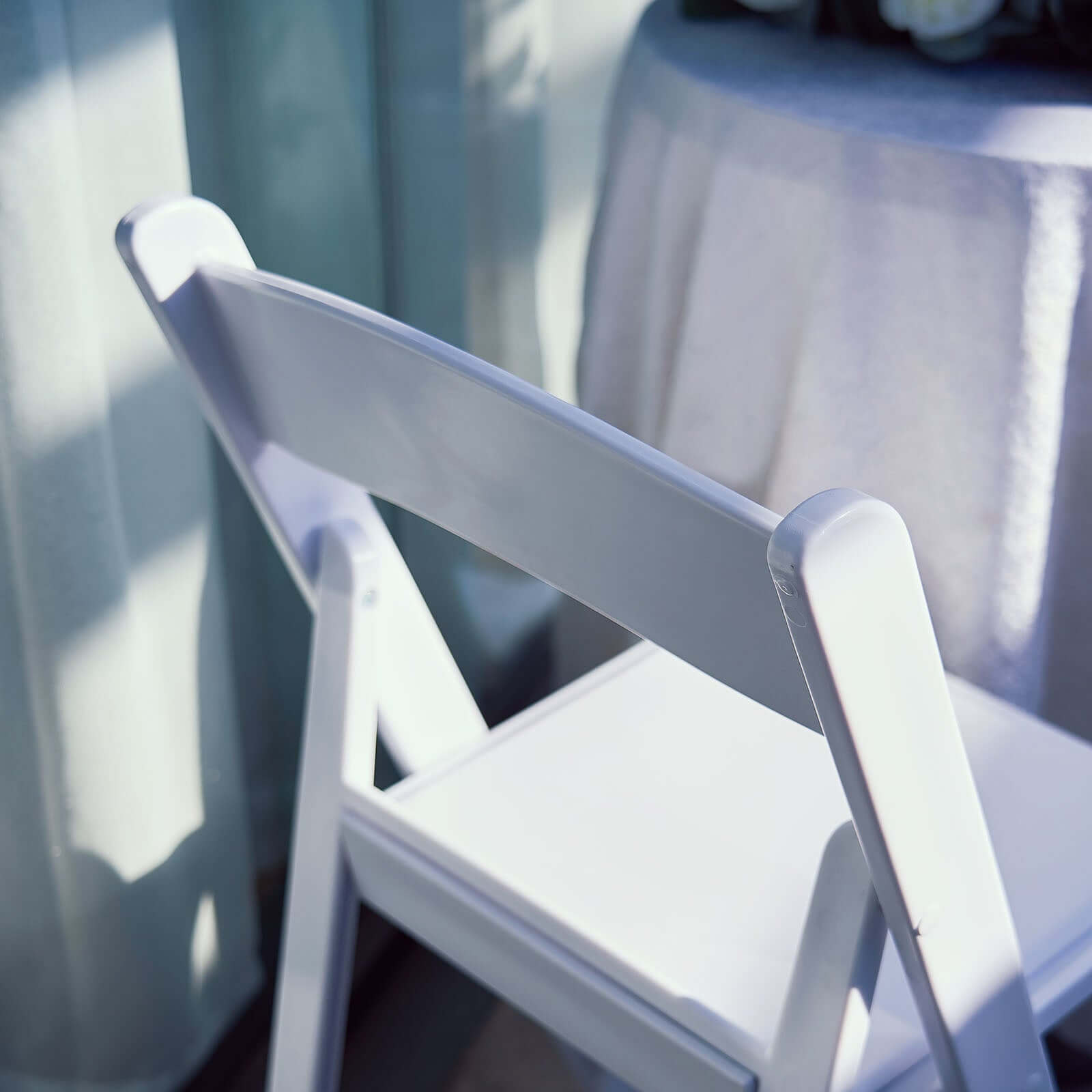 White Resin Folding Chair With Vinyl Padded Seat For Weddings, Indoor or Outdoor Events