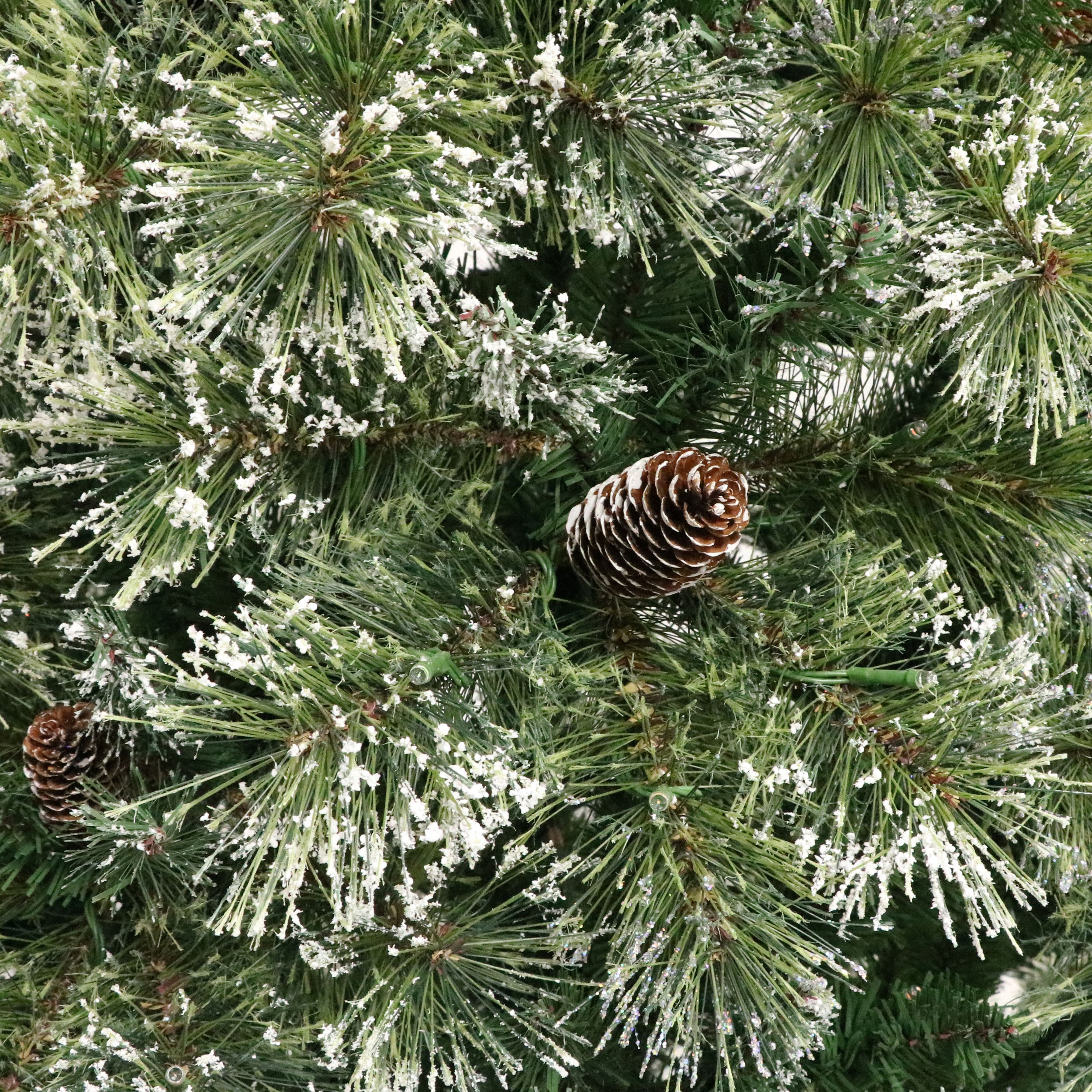 7-foot Cashmere Pine and Mixed Needles Pre-Lit Clear LED Hinged Artificial Christmas Tree with Snow and Glitter Branches and Frosted Pinecones