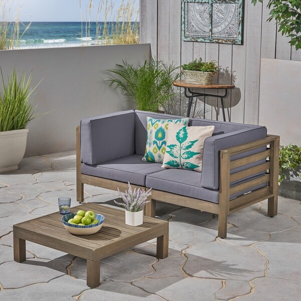 Oana Outdoor 2Seater Acacia Wood Sectional Loveseat and Coffee Table Set with Cushions by Christopher Knight Home