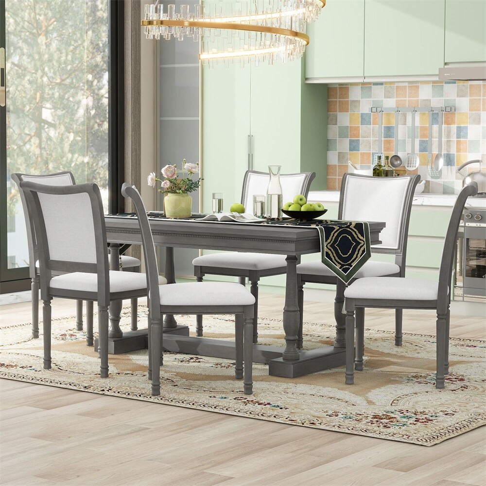 7 Piece Dining Table with 4 Trestle Base and 6 Upholstered Chairs