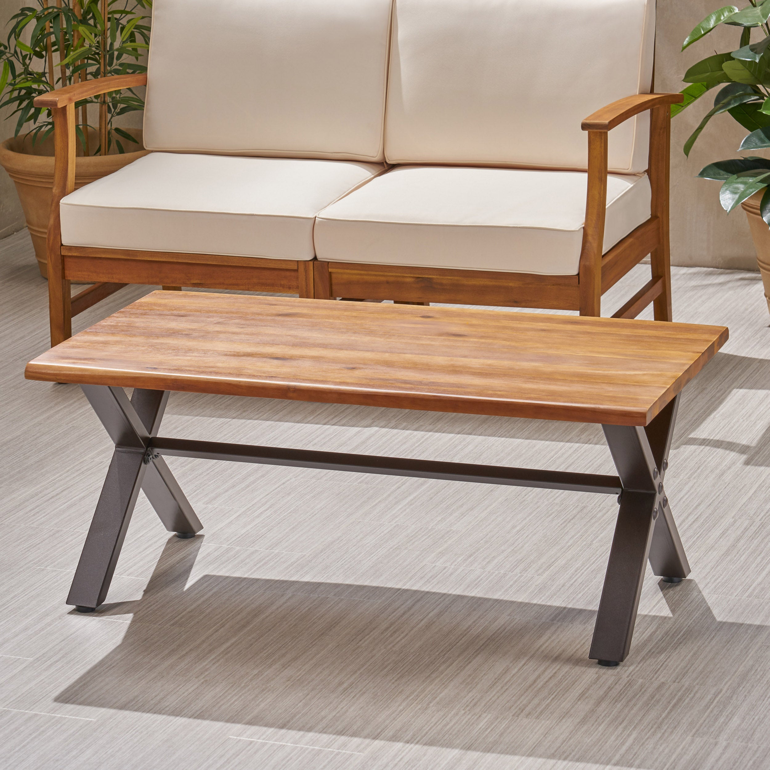 Ishtar Outdoor Farmhouse Teak Acacia Wood Coffee Table with Black X-Frame Legs