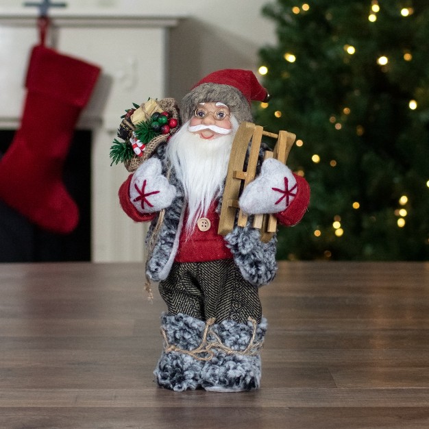 Standing Santa Christmas Figure Carrying Presents And A Sled