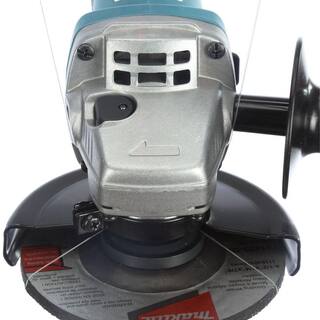 Makita 7.5 Amp Corded 4.5 in. Easy Wheel Change Compact Angle Grinder with bonus 4.5 in. Turbo Rim Diamond Blade 9557NB-B-69696