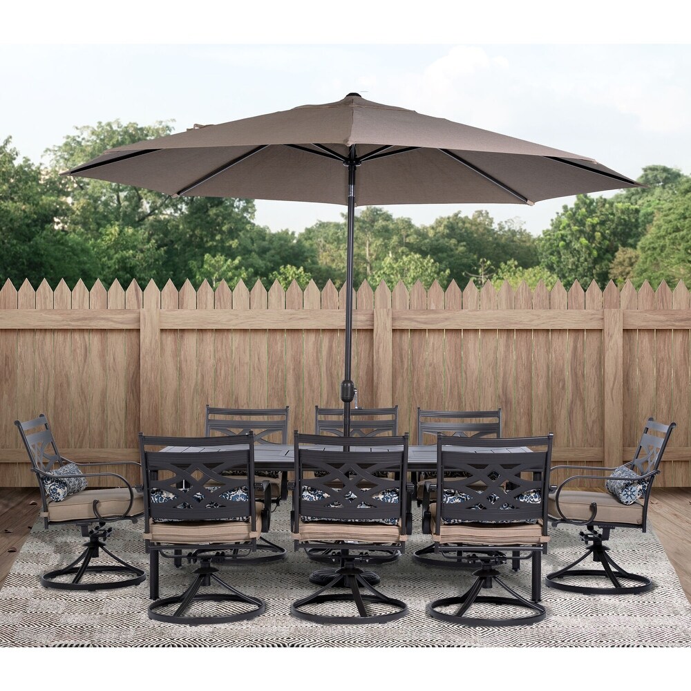 Hanover Montclair 9 Piece Dining Set in Tan with 8 Swivel Rockers  42 In. x 84 In. Table  11 Ft. Umbrella and Umbrella Stand