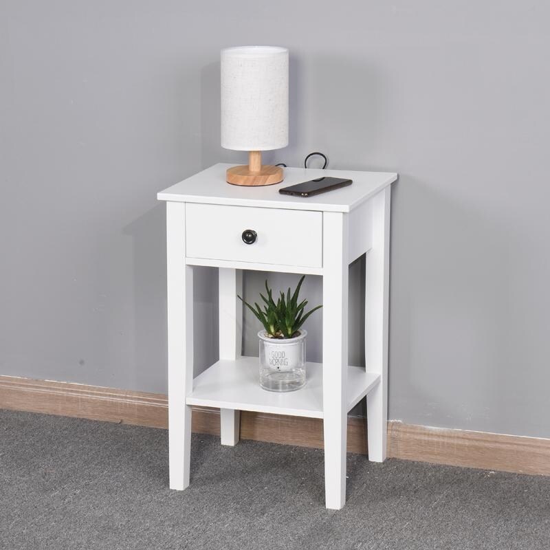 The white bathroom floor to ceiling storage table has a drawer