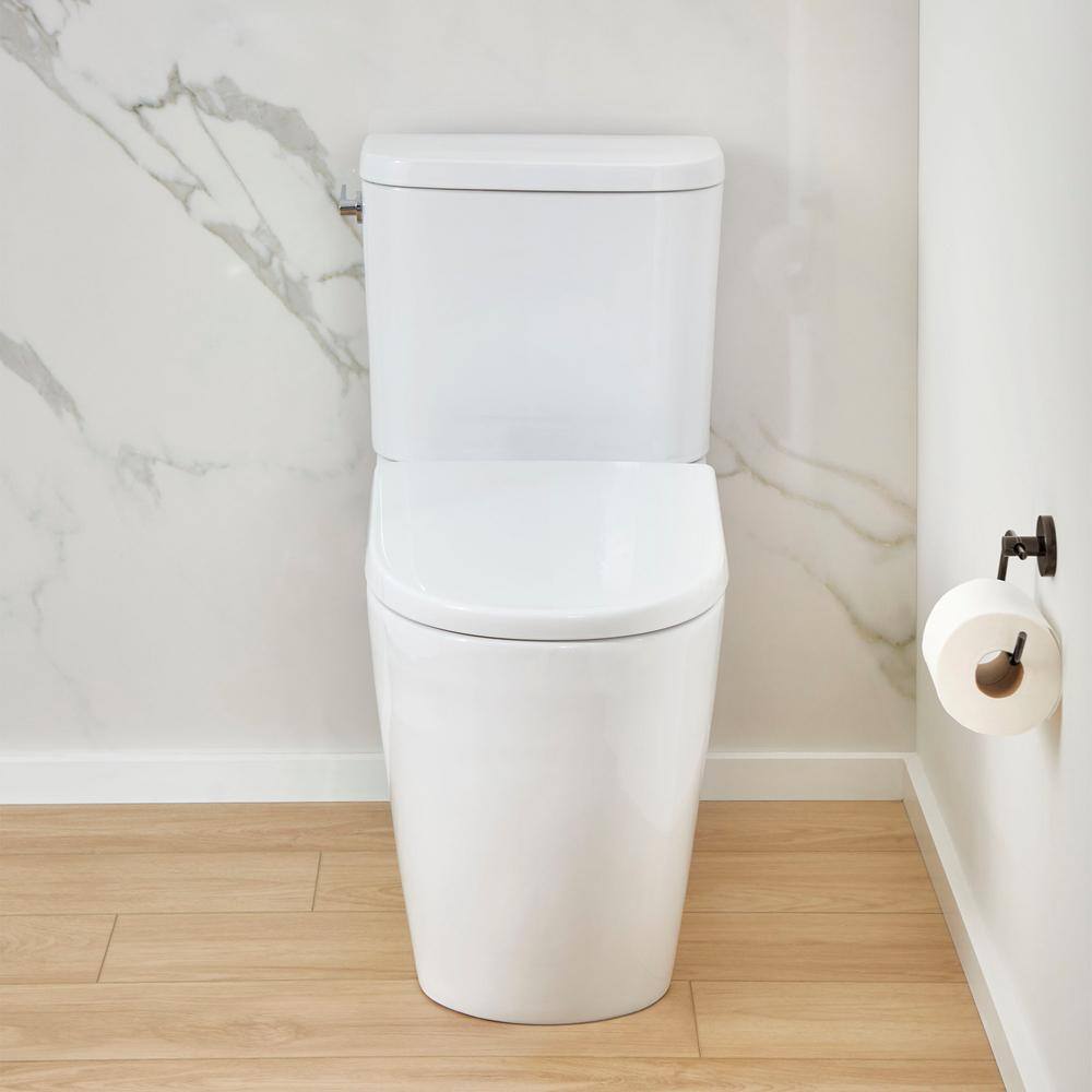 GROHE Essence 2-piece 1.28 GPF Single Flush Elongated Toilet with Left Hand Trip Lever in Alpine White Seat Included 39675000