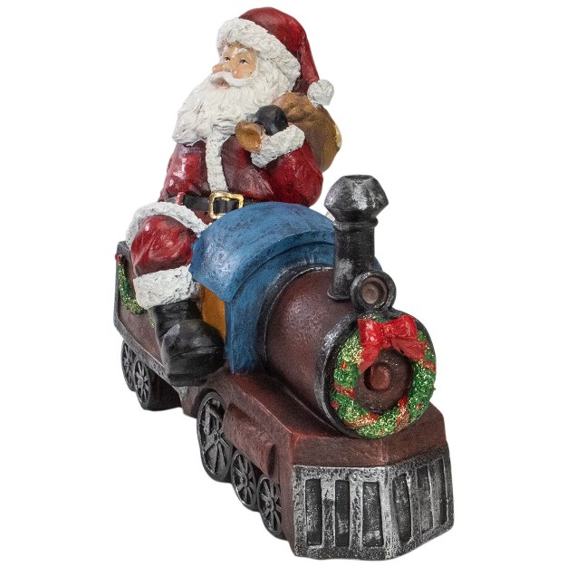 Red And Blue Santa On A Train Christmas Tabletop Decoration