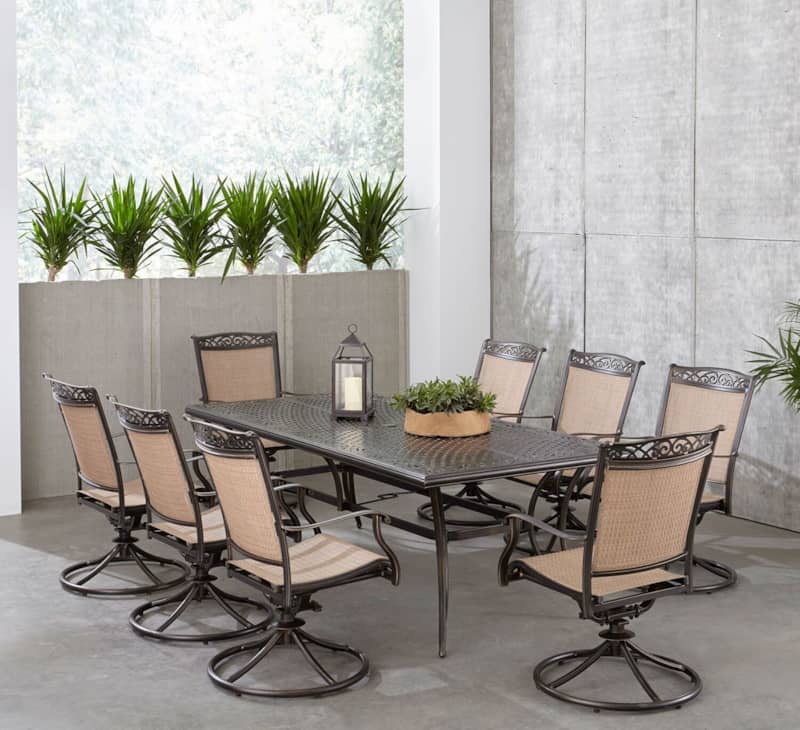 Hanover Fontana 9-Piece Outdoor Dining Set In Tan/Bronze With 8 Sling Swivel Rockers and 42and#215;84 Cast Table