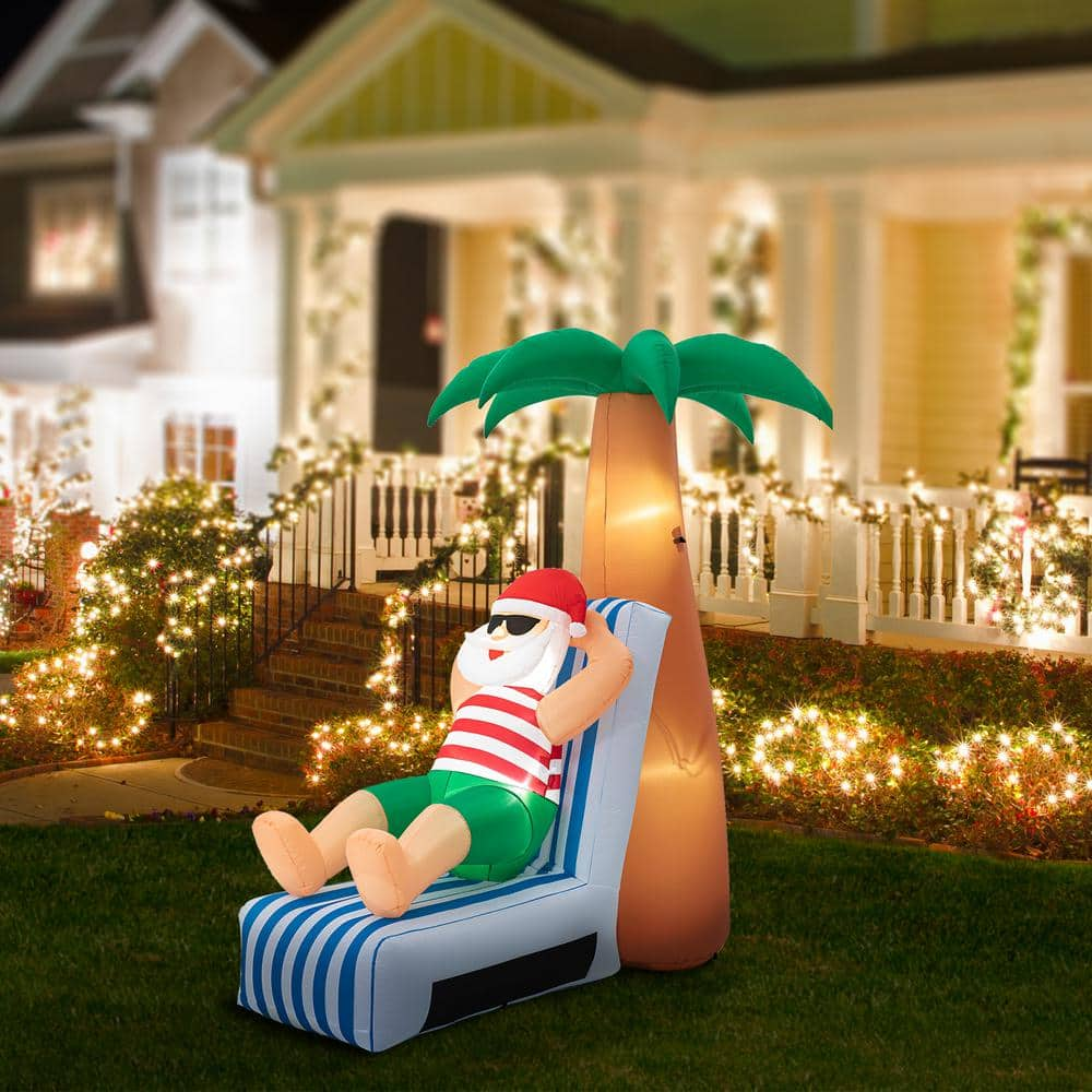 6 ft. H 2 ft. Inflated width Lighted Santa Under Coconut Tree Decor 2005200026