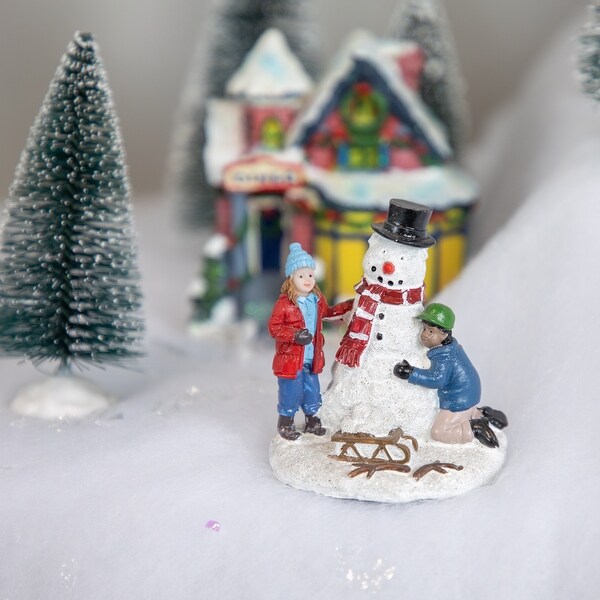 Children Build a Snowman Christmas Village Display Piece