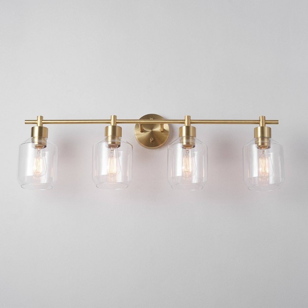 Cannes 4 light Matte Brass Vanity Light With Clear Glass Shades Globe Electric