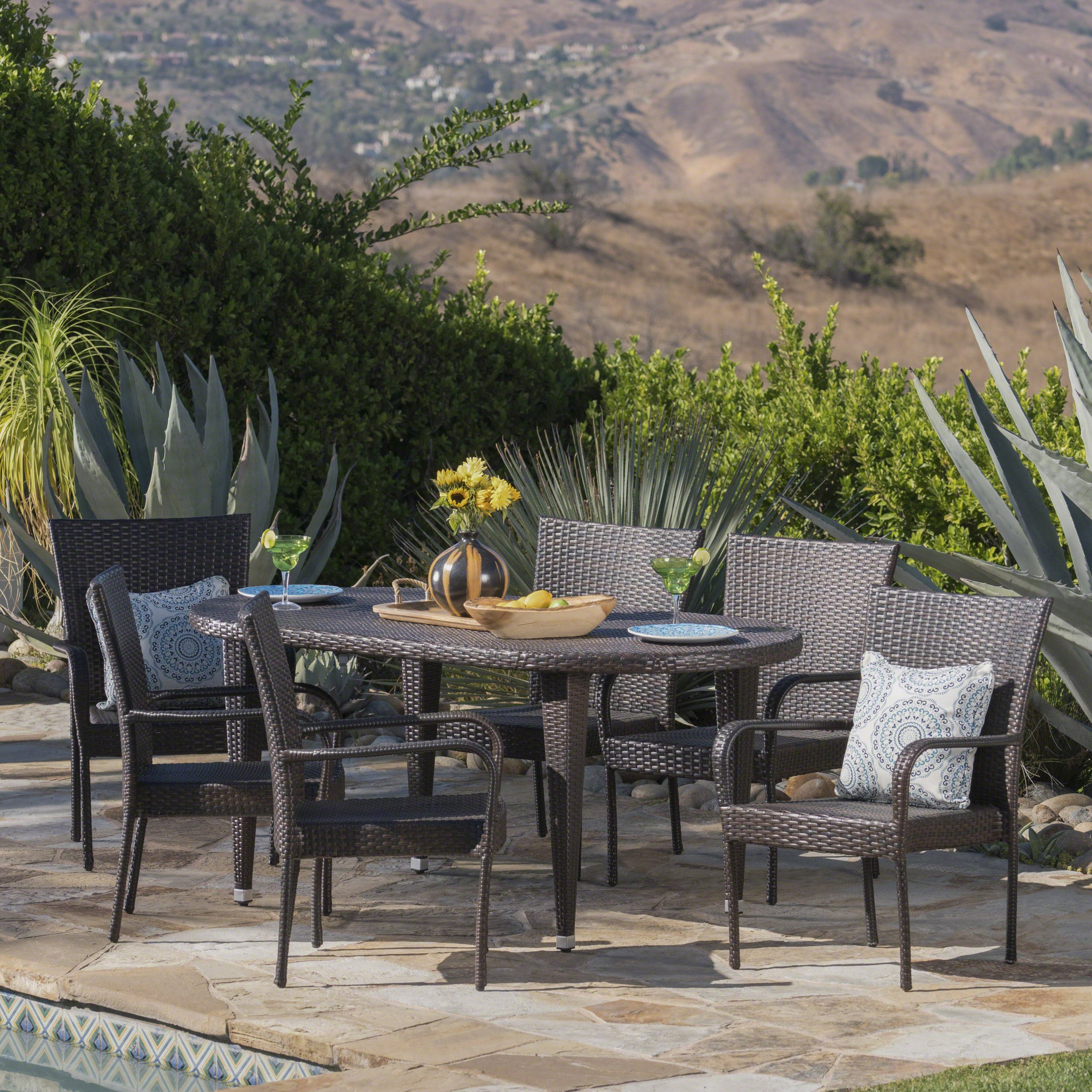 Sophilynn Outdoor 7 Piece Multi-brown Wicker Oval Dining Set with Stacking Chairs