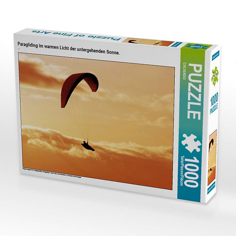 Paragliding im warmen licht der untergehenden sonne. - calvendo foto-puzzle