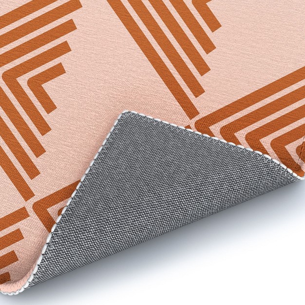 June Journal Triangular Lines In Terracotta Outdoor Rug Deny Designs