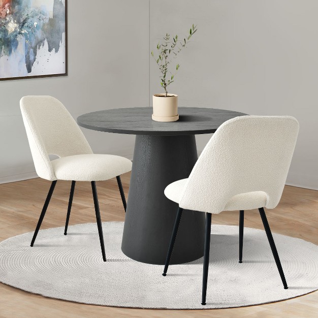 Black Round Concrete Dining Table And 2 Upholstered Boucle Chairs the Pop Maison