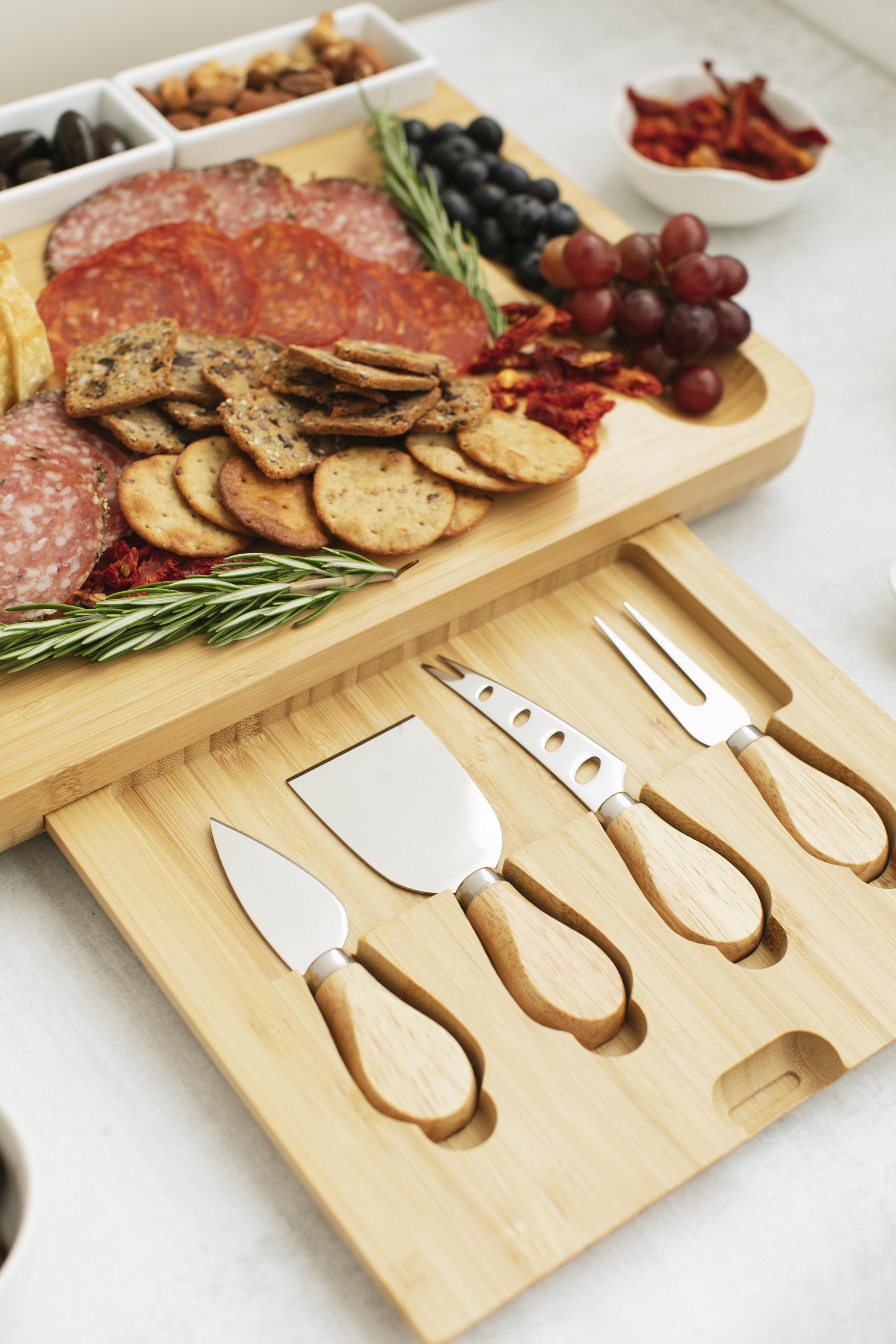 Natural Bamboo Cheese Board and Cutlery Set with Rectangular Ceramic Ramekins.