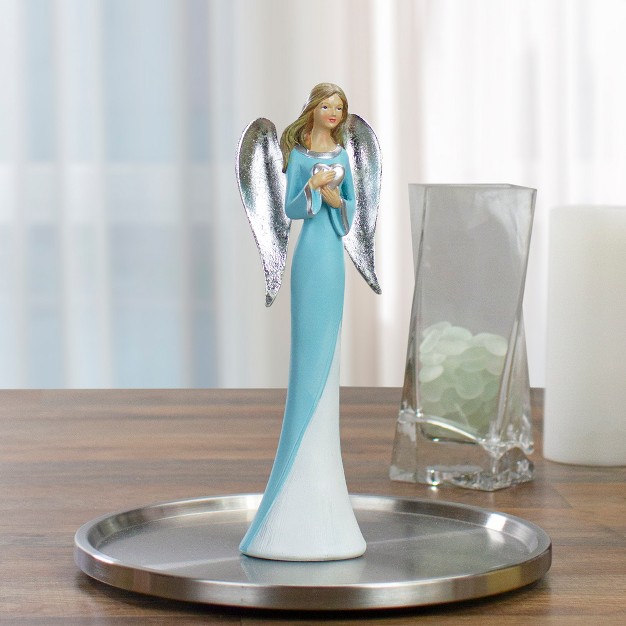 Blue And White Angel Figure Holding A Heart