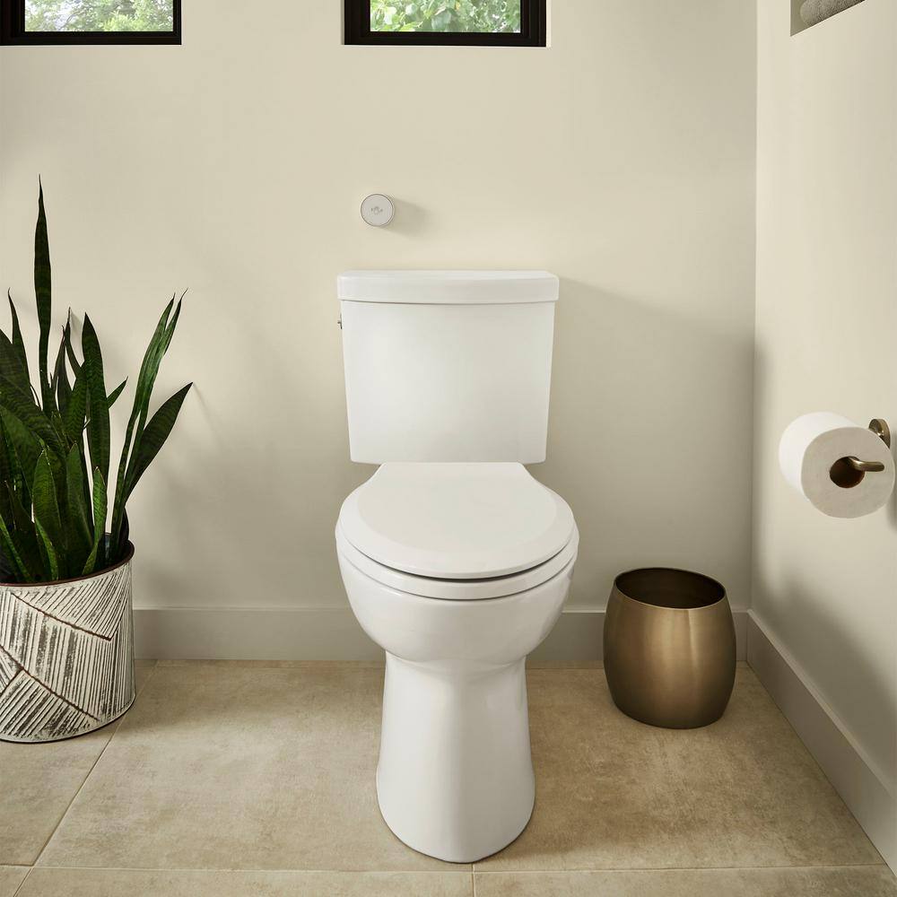 American Standard Cadet Touchless 2-piece 1.28 GPF Single Flush Elongated Toilet in White Seat Included 580AA709.020