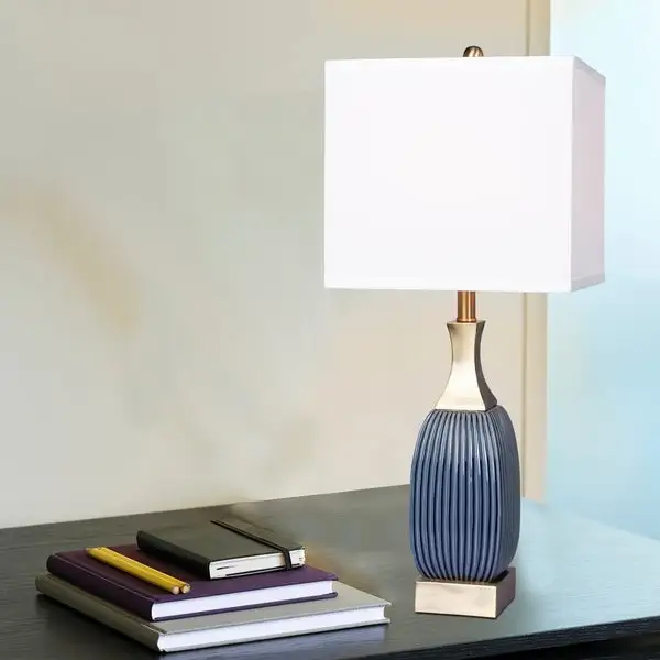 Fangio Lighting's #8987BAB 26.5 in. Vertically Ribbed Blue Ceramic and Antique Brass Table Lamp