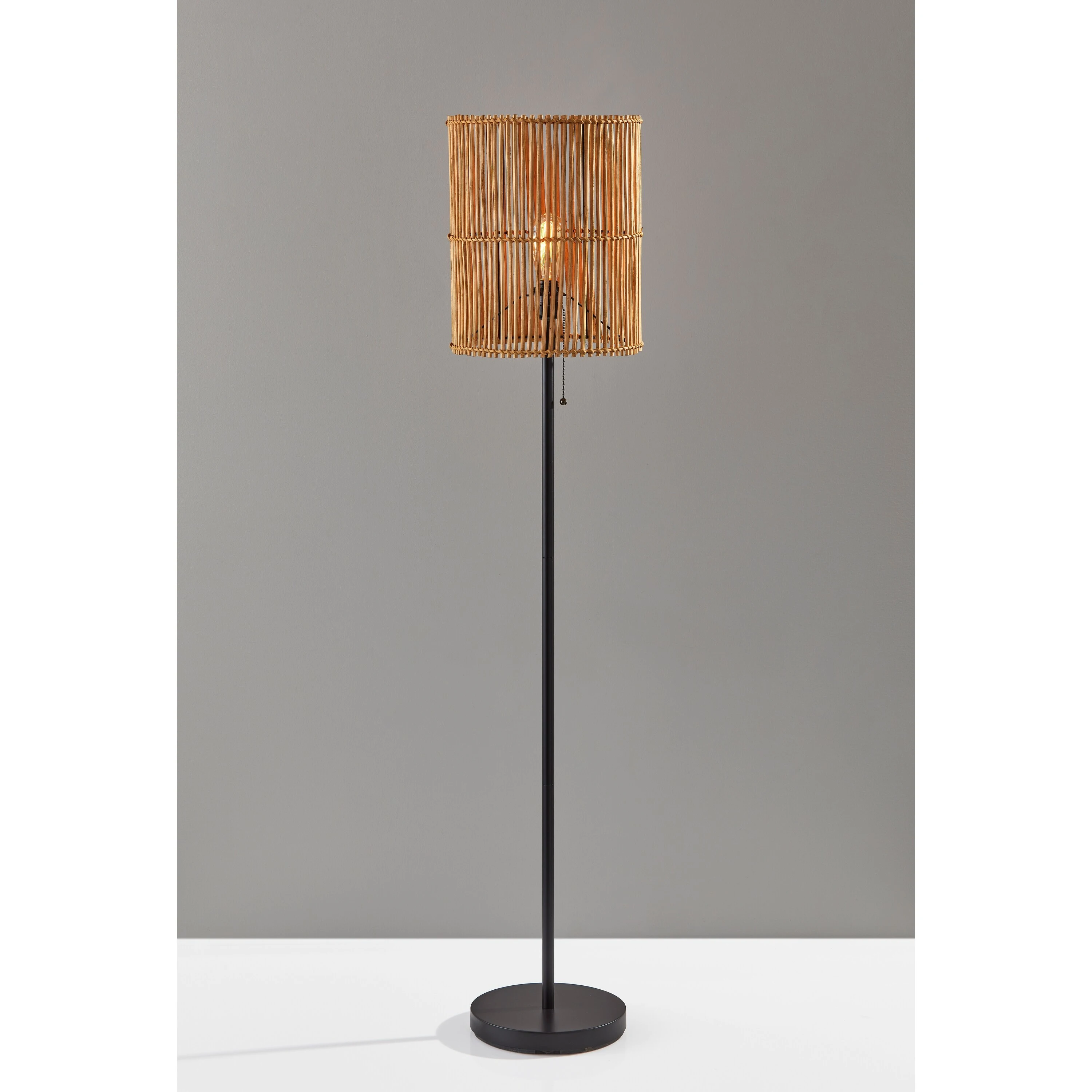 The Curated Nomad Sabla Dark Bronze Floor Lamp with Rattan Shade