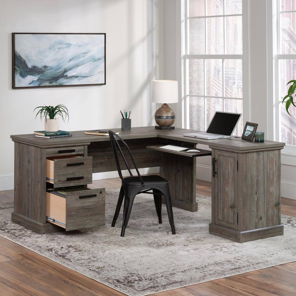 SAUDER Aspen Post 65.118 in. L-Shaped Pebble Pine 3-Drawer Computer Desk with Keyboard Shelf and Cord Management 433686