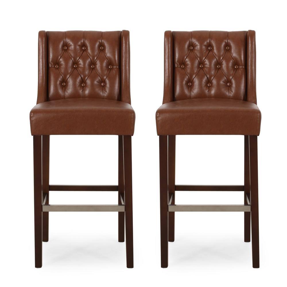 Noble House Bayliss 44.25 in. Cognac Brown High Back Wood Bar Height Foot Rest Bar Stool with Faux Leather Seat (Set of 2) 83320