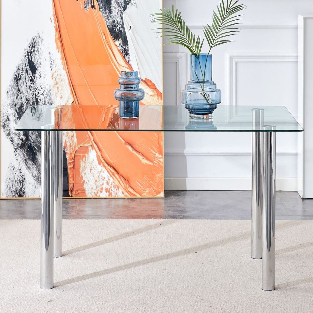 Modern minimalist dining table with transparent tempered glass desktop