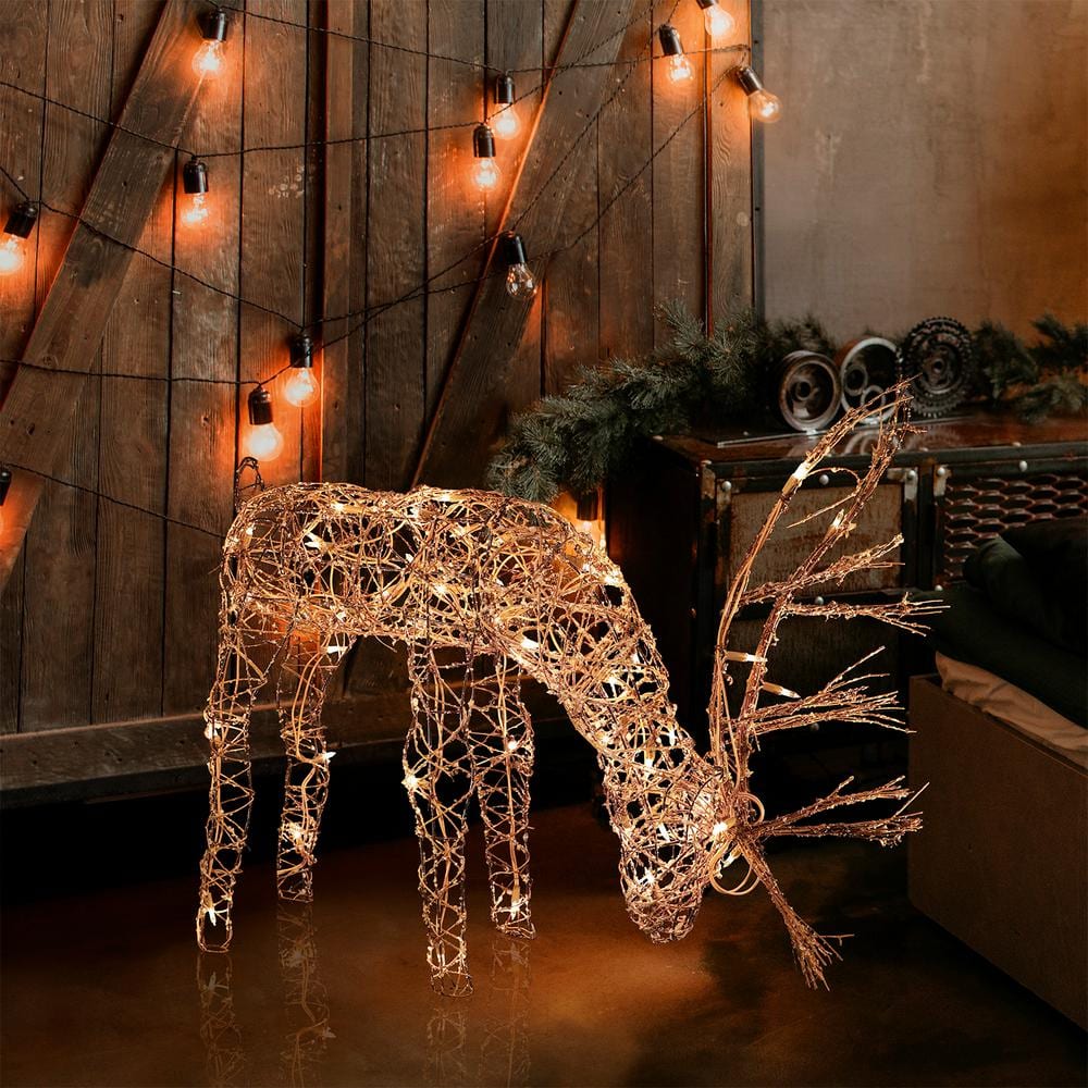 Alpine Corporation 24 in. Tall Rattan Grazing Reindeer Decoration with Halogen Lights AUH166