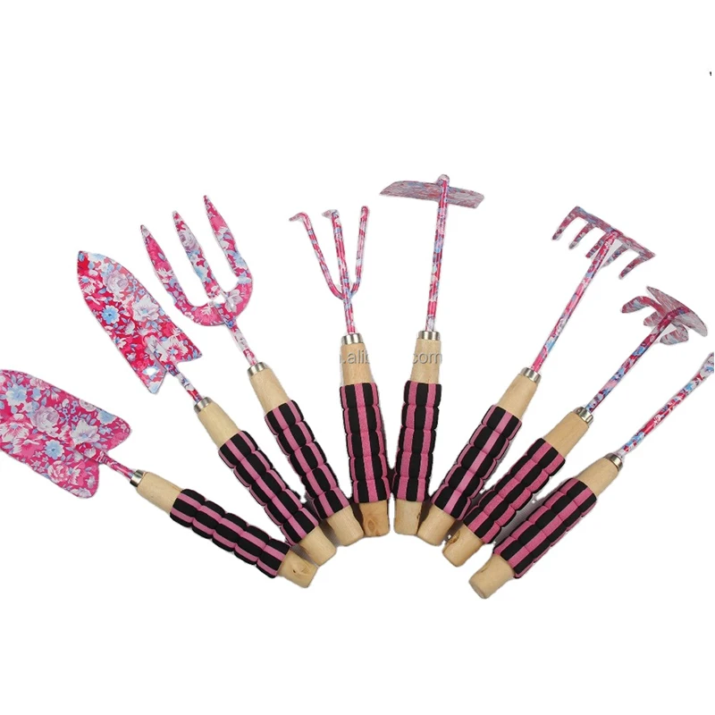 Metal flower print garden tools include hand spade and ground fork tools