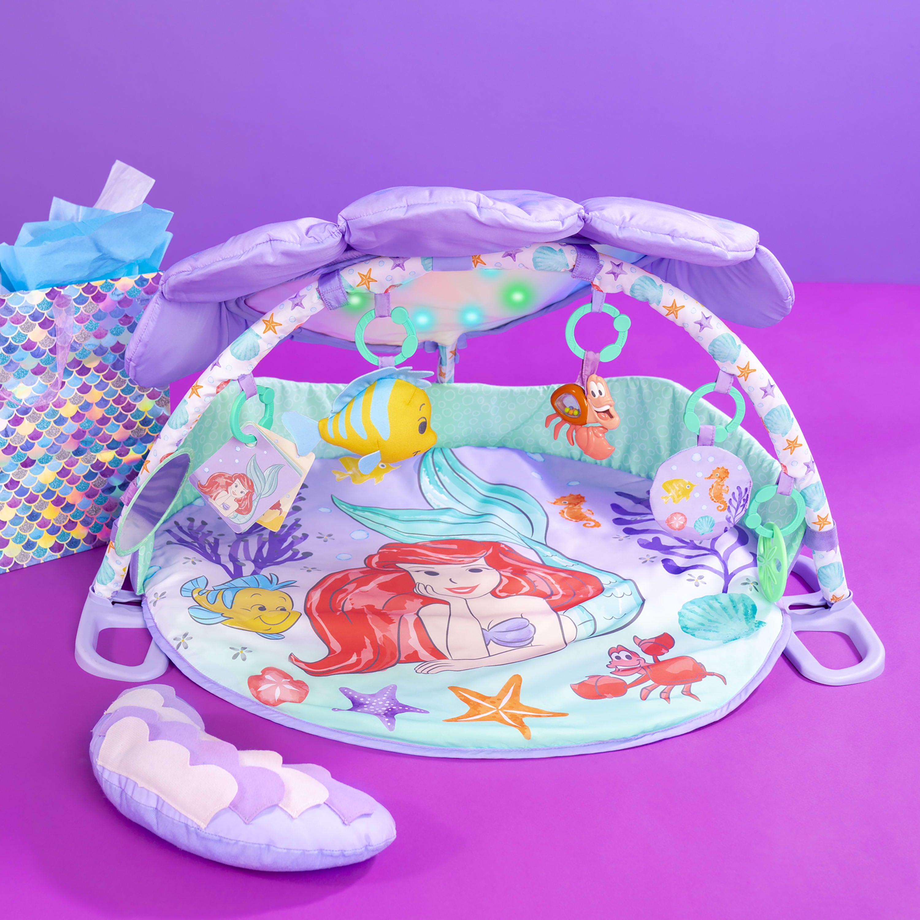 Bright Starts The Little Mermaid Twinkle Trove Light-Up Musical Baby Activity Gym with Tummy Time Pillow， Newborn+