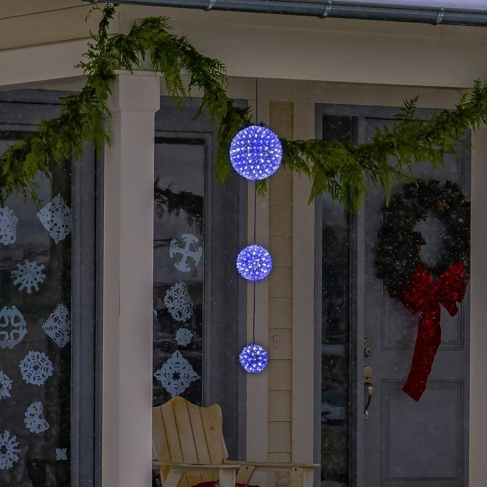 Alpine Corporation 37 in. Tall 3-Tier Christmas Ornaments With Chasing Blue and White LED Lights COR164